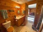 Lower level bathroom with a shower stall and the laundry room 